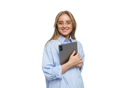 Young woman in light blue shirt joyfully holding a tablet in a minimalistic studio setting