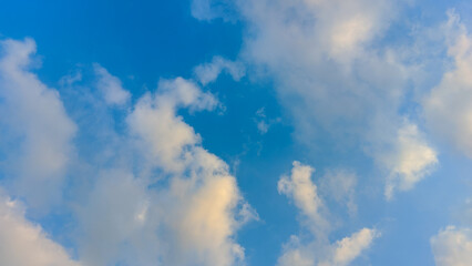 Beautiful bright sky with puffy white clouds, serene and calm
