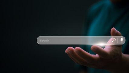 Information search technology, search engine optimization, male hand using a smartphone to search information, using the search bar function on your website
