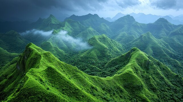 Lush green mountains under dramatic stormy skies