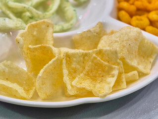 Crunchy snacks arranged on a plate invite casual sharing and enjoyment during a gathering at a cozy cafe