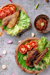 Two plates of food with meat and vegetables on a table