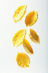 Naklejka premium Frozen peeled sunflower seeds suspended mid-air against a pure white backdrop , isolated, texture