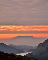 Morning atmosphere with light fog on high mountains