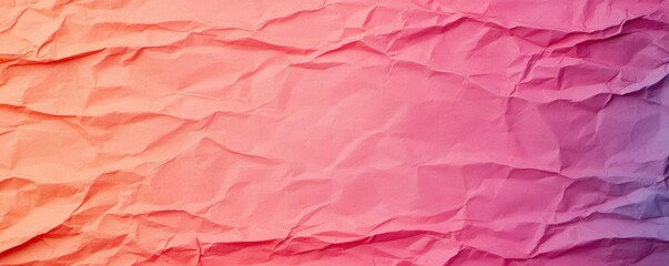 Fototapeta premium A vibrant, crumpled paper texture featuring gradients of pink and orange, creating a visually appealing backdrop.