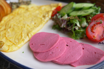 Delicious breakfast plate featuring omelette and fresh vegetables