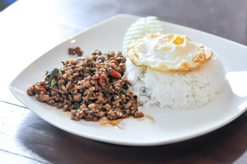 stir fried pork with holy basil , sunny side up egg and rice
