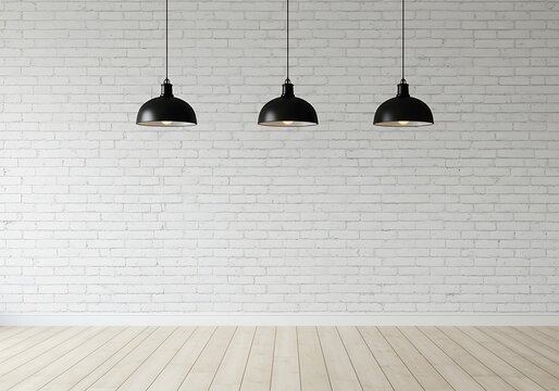 Fototapeta Three black pendant lights hanging against a white brick wall in a room with a wooden floor