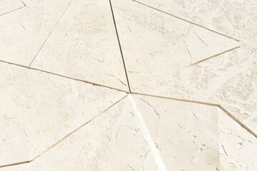 Abstract design of light beige stone tiles