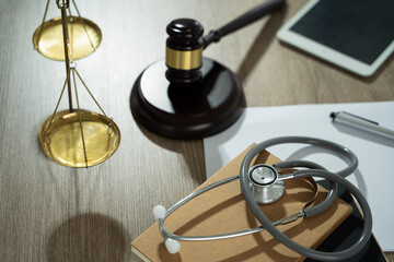 medicine law A doctor and a lawyer discussed health care, justice, and ethics in a clinic,...