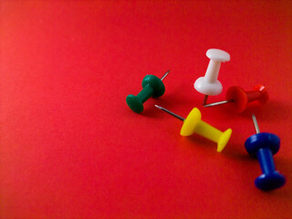 push pins on red paper
