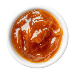 a small white bowl filled with a glossy. thick. orange-brown condiment that appears to be a fruit-based sauce or jam. likely intended for use as a spread or topping its smooth texture suggests it coul