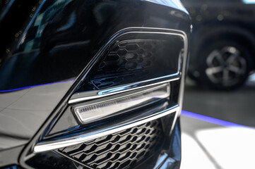 Close up of the headlight of a new modern car
