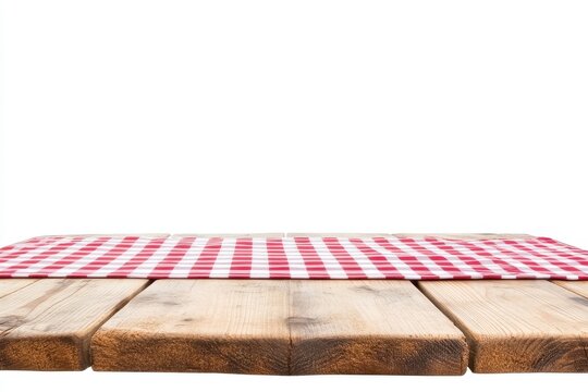 Wooden picnic table with red checkered tablecloth