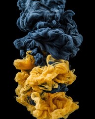 Ethereal dance of navy and golden yellow acrylic paint plumes in water against a stark black backdrop creating a mesmerizing abstract art form