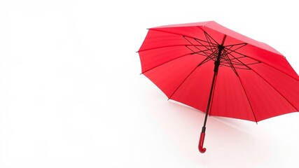 A vibrant red umbrella stands out against a stark white background offe a clean and simple image perfect for various design projects.