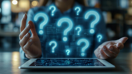 Close-up of hand on tablet with question marks floating above, representing the idea that online questions.