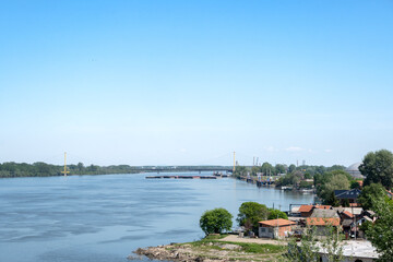 View to the Kovin bridge at Danube river near the the Smederevo town of Serbia. Beautiful landscape ,blue sky at the background.