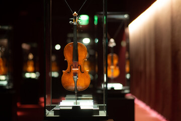Violinmaking historical masterpieces on Display in Treasure box room in violin museum Cremona, Italy