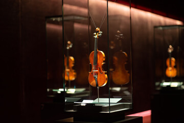 Violinmaking historical masterpieces on Display in Treasure box room in violin museum Cremona, Italy © august.columbo