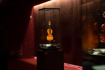 Violinmaking historical masterpieces on Display in Treasure box room in violin museum Cremona, Italy