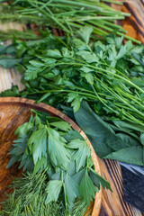Obraz premium fresh greens from the garden, prepared for summer salad in the country.