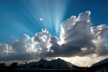 Ray of Sunshine in the Sky with the Silhouette of the Mountain