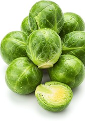 Fototapeta premium Fresh Green Brussels Sprouts Stacked on White Background with Water Droplets
