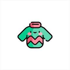 Cute sweater with smiling face rests on white surface, representing cozy and cheerful holiday spirit.