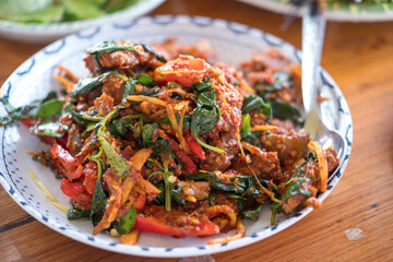 Stir fried catfish with herb and spicy on dish. Spicy food