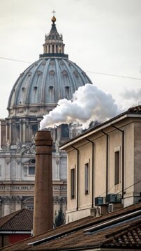 White smoke from Sistine Chapel chimney with St. Peter's Basilica