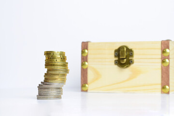 Stacked euro coins, light background.