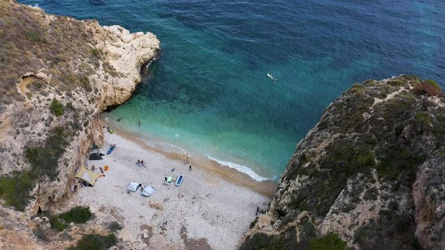 Aerial view of the wonderful Cala del Moraig and Cala de los Tiestos, located between the beautiful cliffs of the town of Benitachell, in the Mediterranean province of Alicante, Spain.
