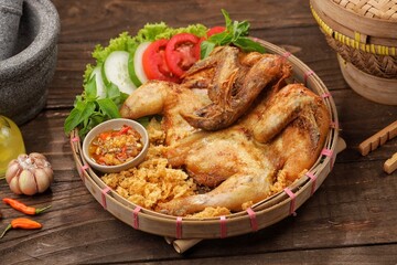 Ayam goreng kremes. Kremes chicken is made from seasoned chicken coated with jeladren (thin batter) made from seasoned wheat flour and fried until golden brown.