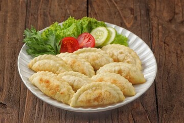 Cireng filled with shredded chicken is a variant of a traditional Sundanese snack made from fried tapioca flour filled with shredded and seasoned chicken.