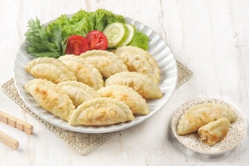 Cireng filled with shredded chicken is a variant of a traditional Sundanese snack made from fried tapioca flour filled with shredded and seasoned chicken.