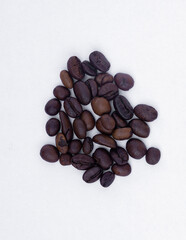 coffee beans arranged on a white background