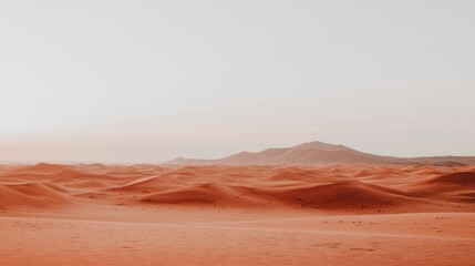 Naklejka premium A desert landscape with a mountain range in the background.