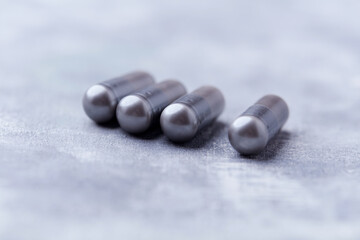 BCAA amino acids tablets. Nutrition for bodybuilding. Fitness supplements on bright background. Soft focus. Copy space.	