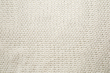 Elegant textured fabric in soft cream color ideal for home decor and fashion projects