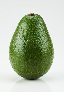 Fresh Avocado Covered in Water Droplets on White Background