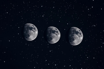 Three full moons shining brightly in a starry night sky