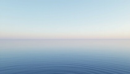 Obraz premium Calm Ocean Water with Gentle Ripples at Dawn or Dusk
