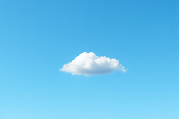 single white cloud in a clear blue sky
