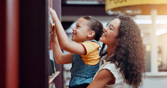 Mom, girl and help by bookshelf at library with lift, smile and support for education, development and reading. Family, mother and daughter with search for book, story and literature for learning