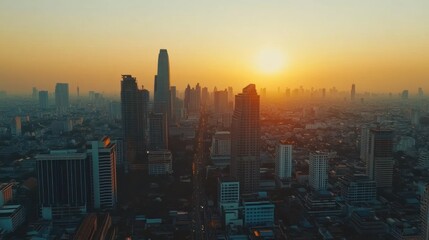 Fototapeta premium A panoramic view of a city skyline during sunset, showcasing urban architecture and atmosphere.