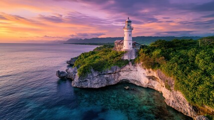 Fototapeta premium A scenic lighthouse perched on a cliff at sunset, surrounded by ocean and lush greenery.
