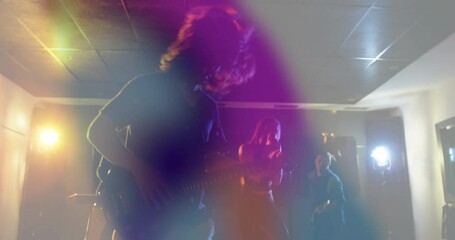 Male bassist playing electric bass under haze while animated waveforms boosting music industry vibe