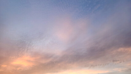 The soft pink sky of a Mediterranean spring evening creates a serene and dreamy background for the design, evoking warmth and tranquility.