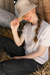 Young woman Embracing Rural Lifestyle in Rustic Barn Setting